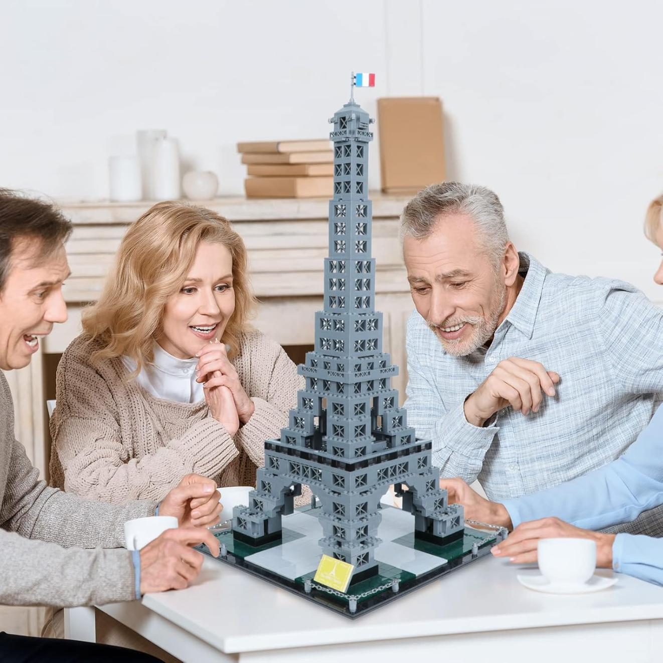 adults making the Eiffel tower blocks