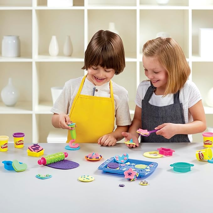 SQUISH, SQUEEZE, AND SHAPE - Cut different shapes with the 4 Play-Doh cookie cutters, squeeze pretend frosting, squish funky patterns into Play-Doh compound with the rolling pin, and more